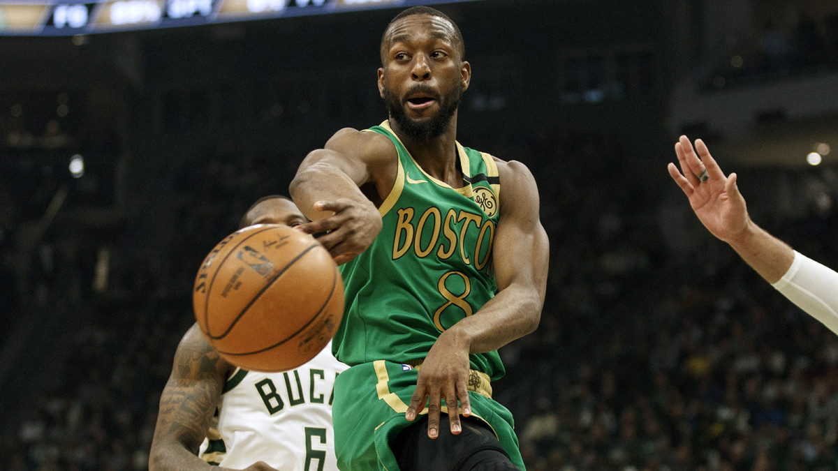 Kemba Walker passes the ball against the Milwaukee Bucks